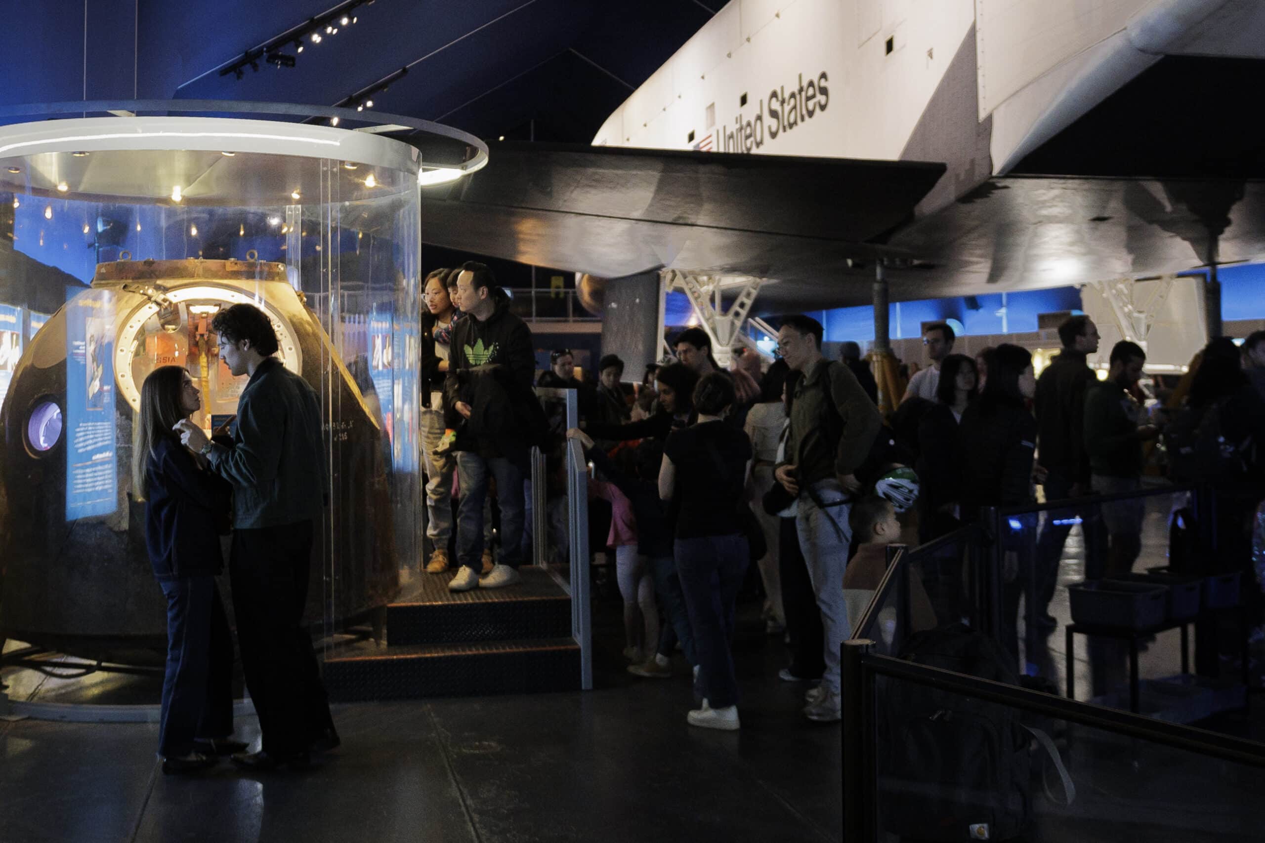 Visitors look at the Soyuz TMA-6 capsule on display at the museum.